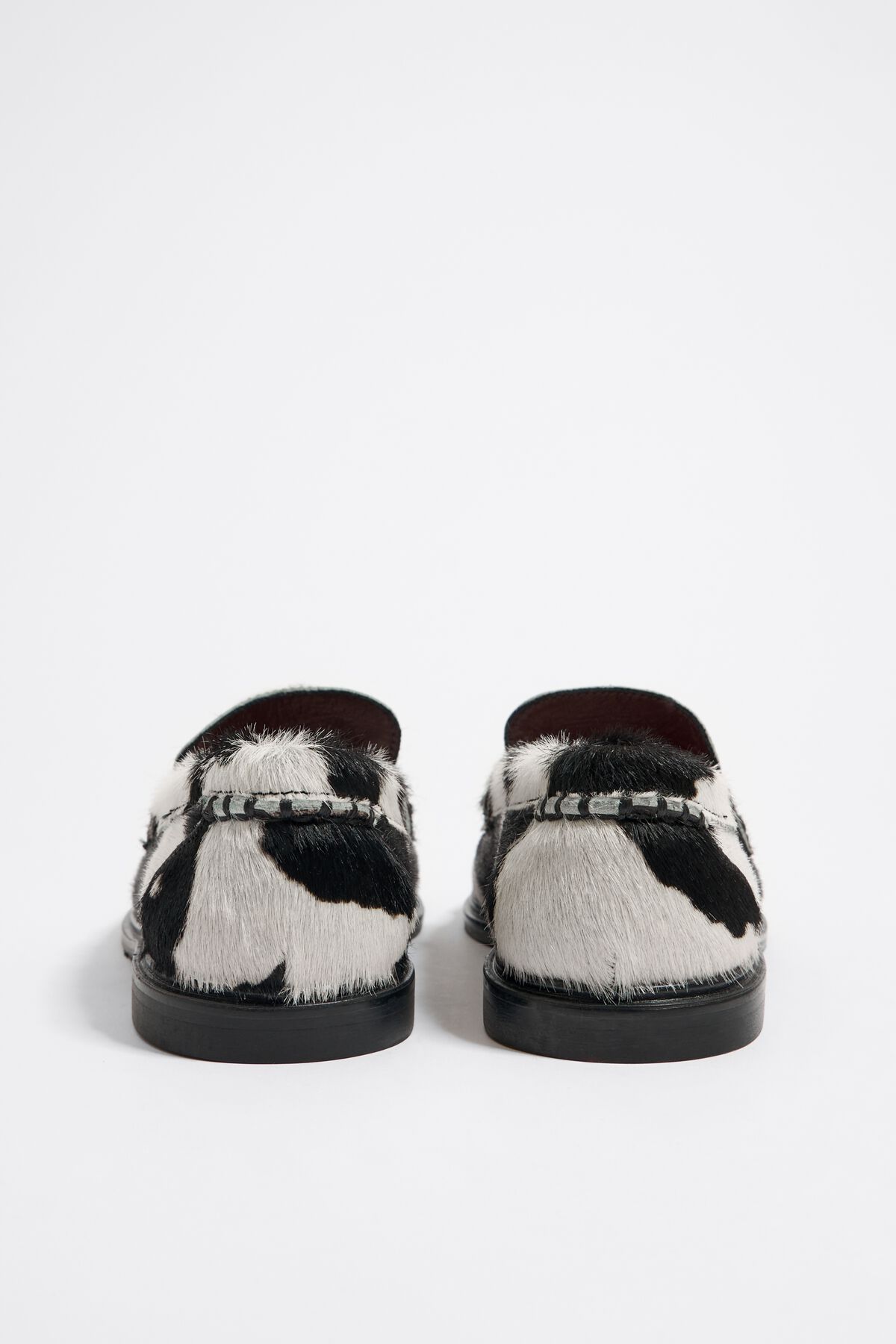 Bimba Y Lola Cow-print Penny-slot Loafers in Black