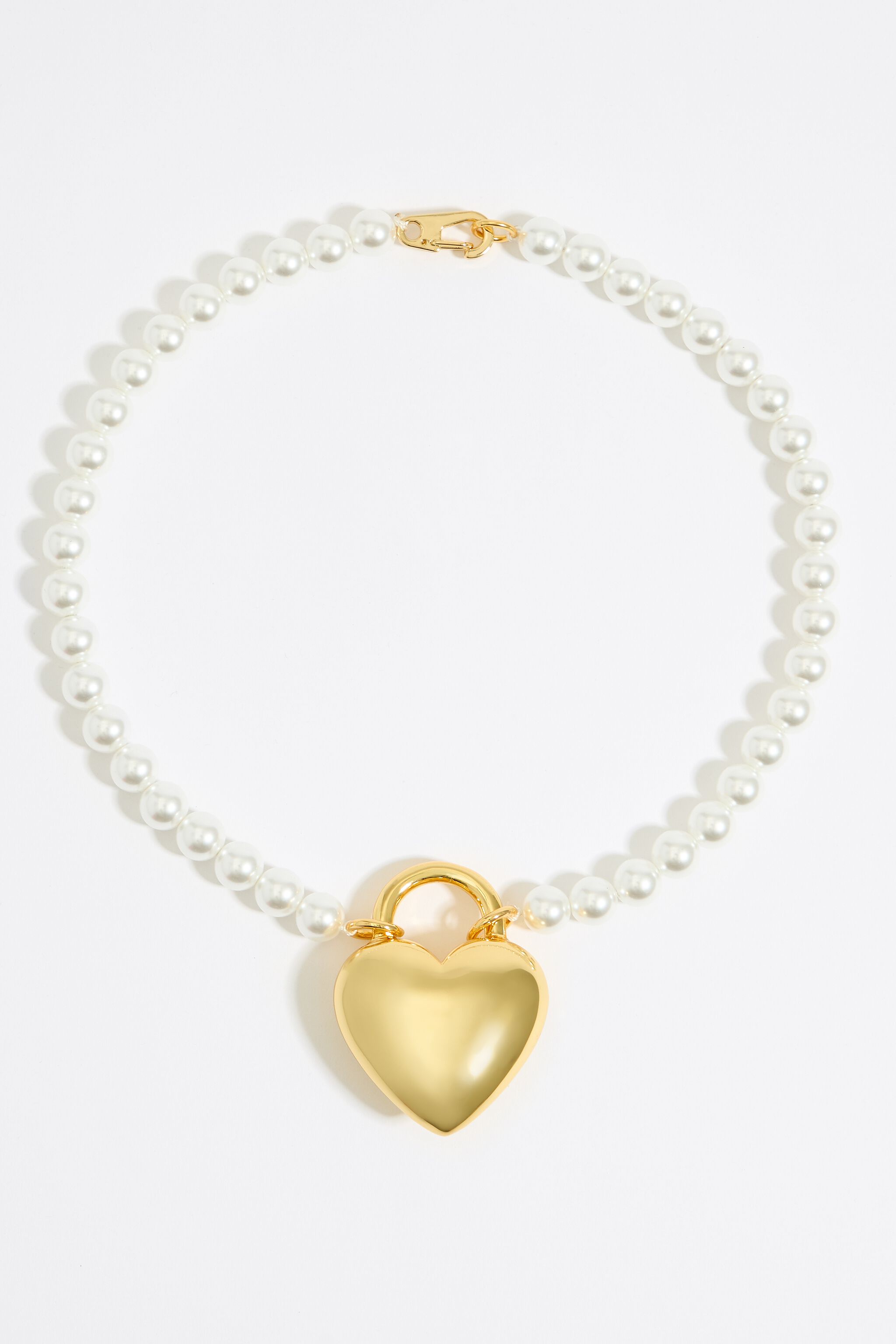 Pearl and golden metal heart necklace