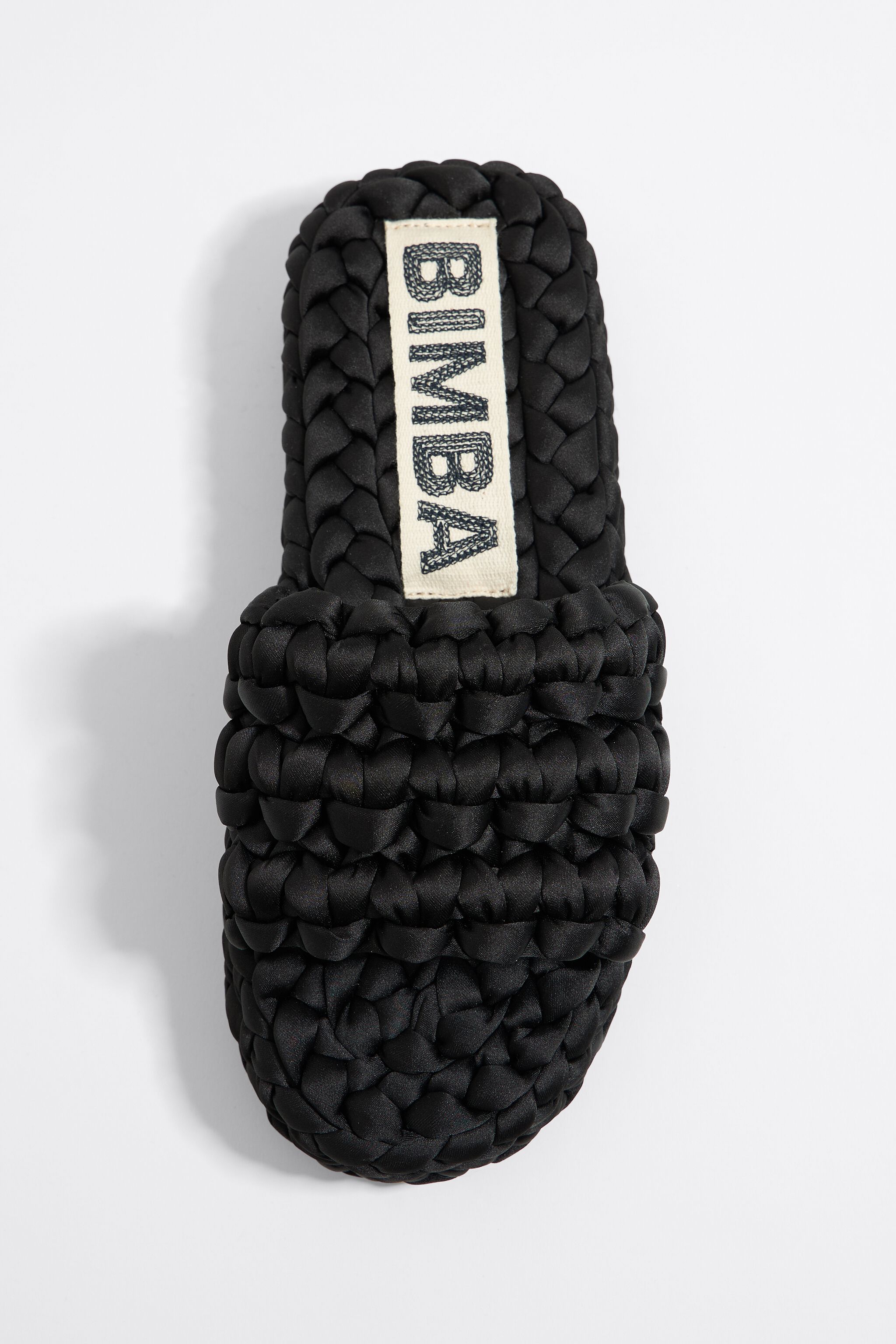 Black plaited flat sandal