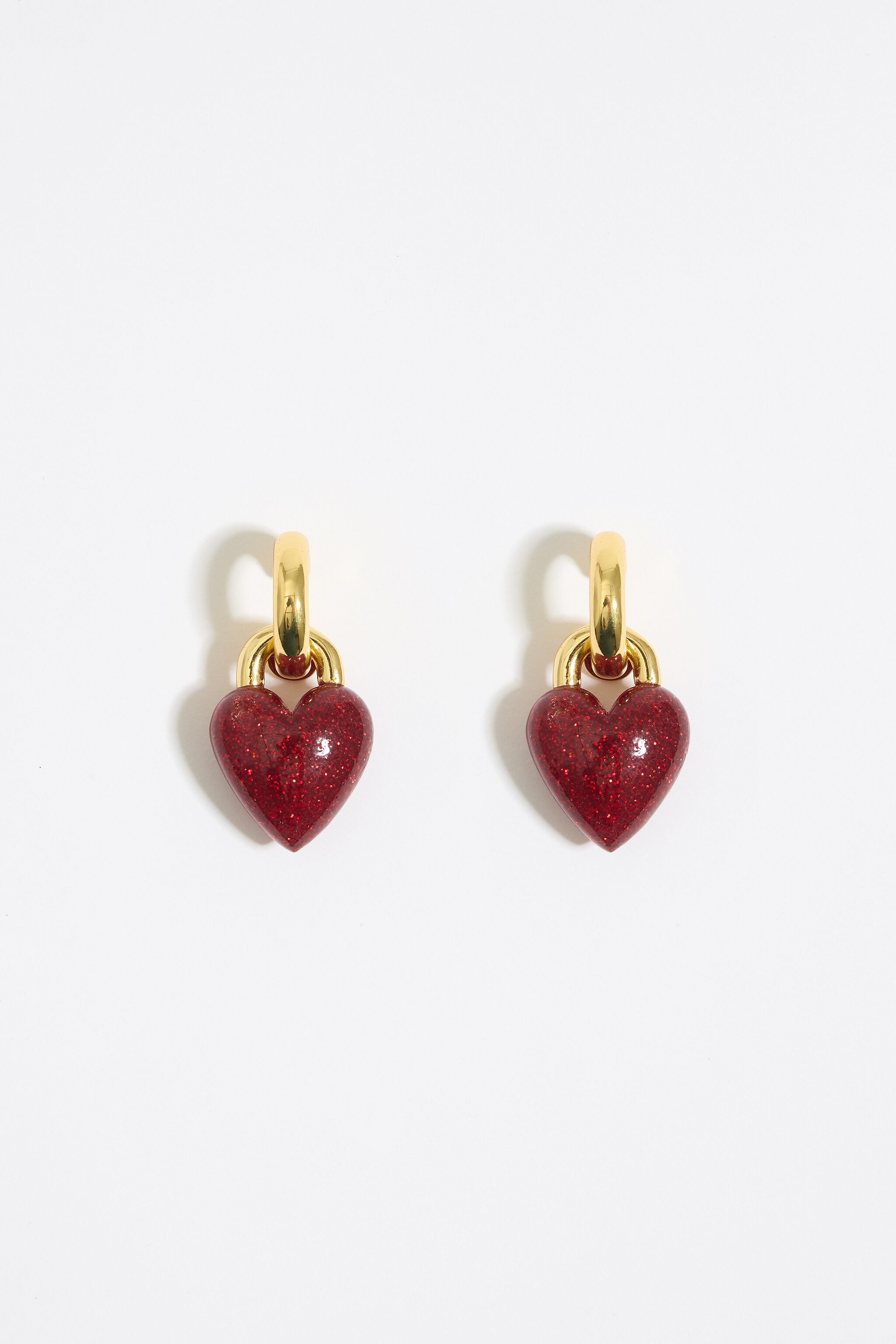 Hoop earrings with red glitter heart
