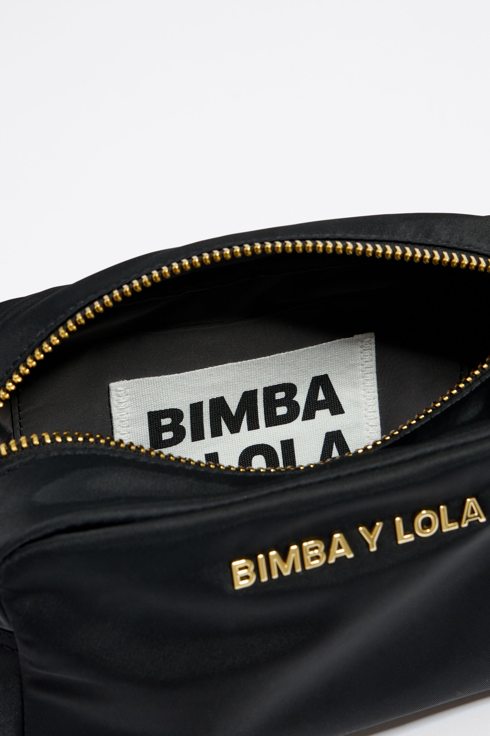 Bimba y Lola, Bags, Bimba Y Lola Black Nylon Crossbody Bag With Leather  Strap