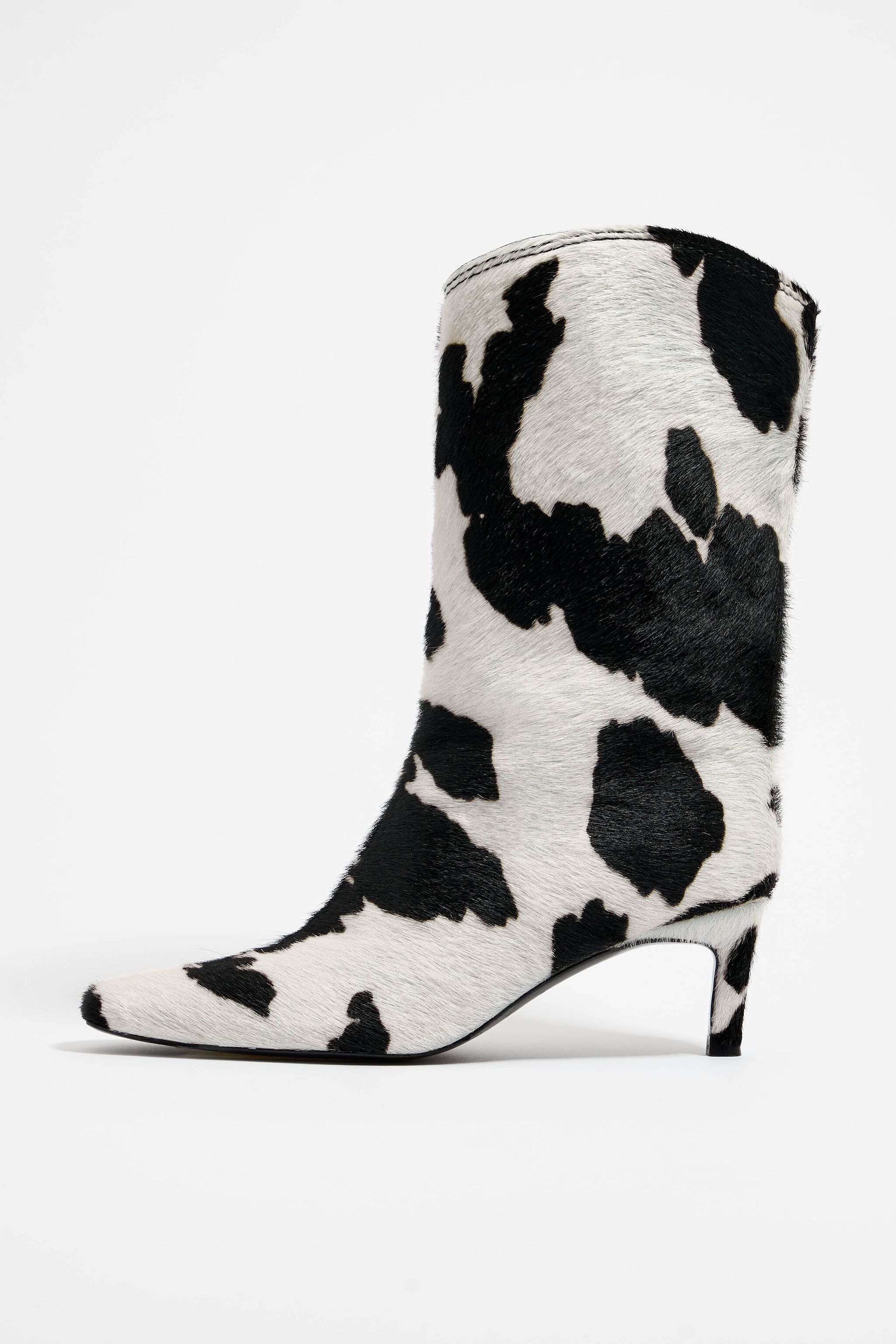 Cow print knee high clearance boots